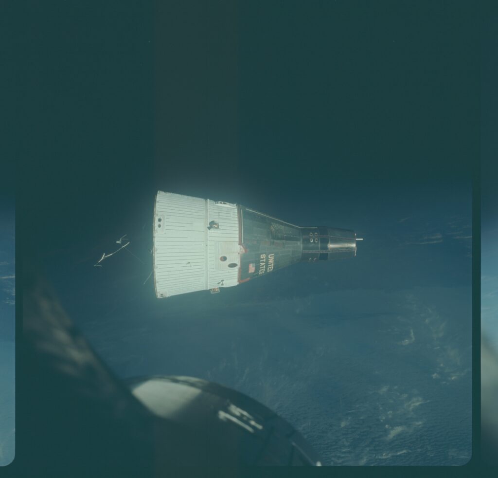 A spacecraft docking above earth's atmosphere.
